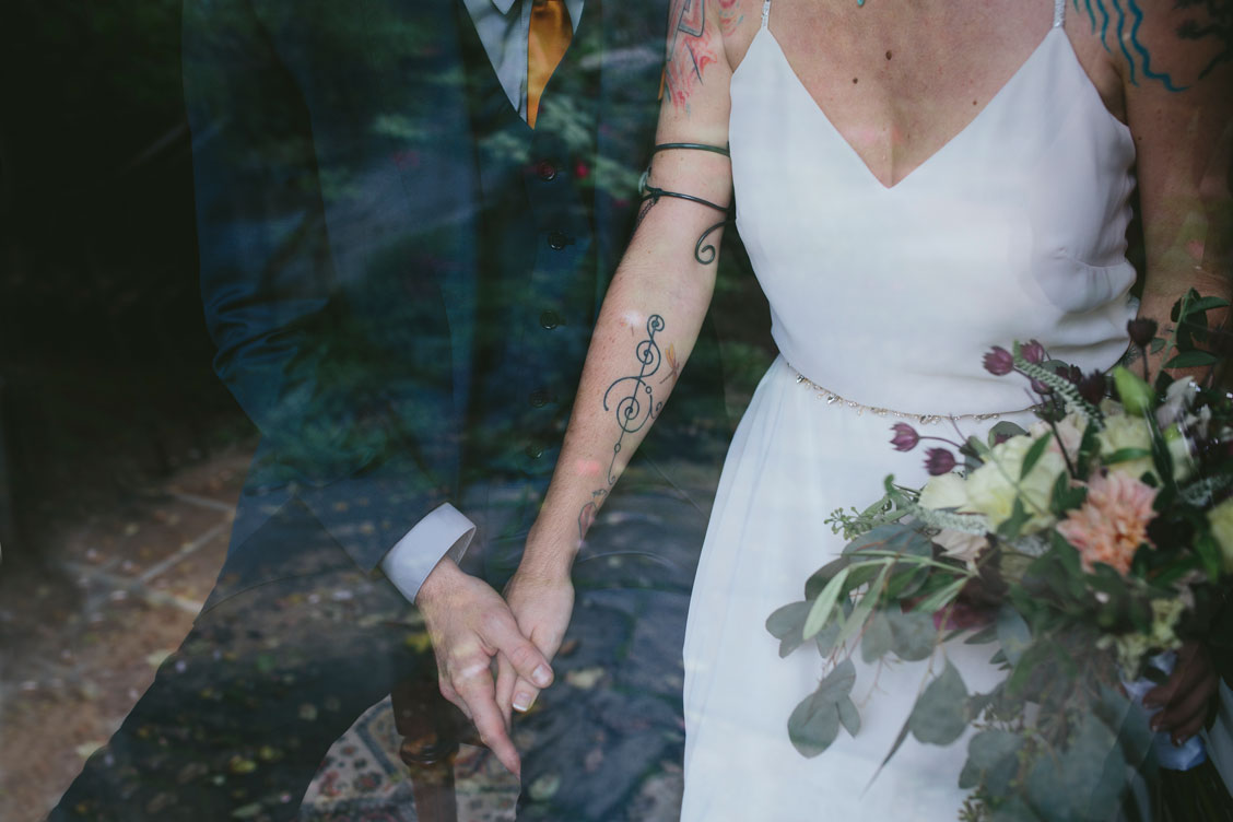 Stinson Beach Wedding - holding hands with bouquet by Becca Henry Photography