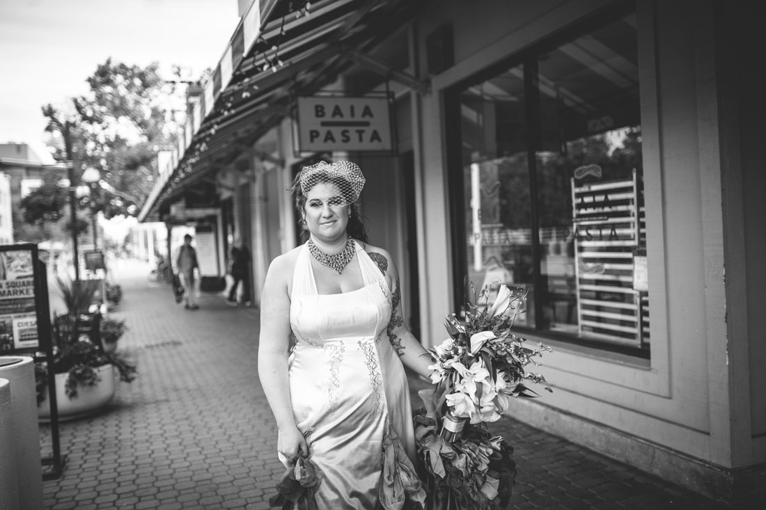 Bride walking down Jack London Square by Becca Henry Photography