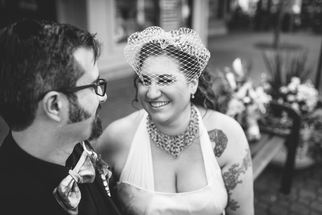 BW image of wedding couple snuggling by Becca Henry Photography