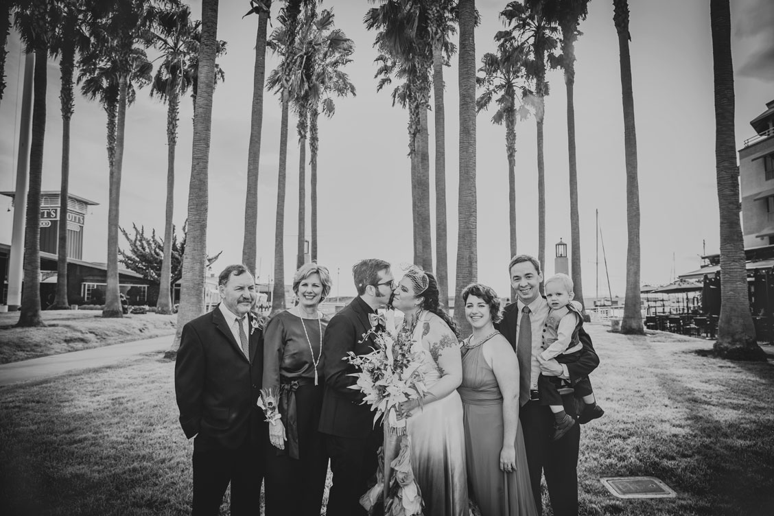 BW family portrait under the palm trees in Jack London Square by Becca Henry Photography