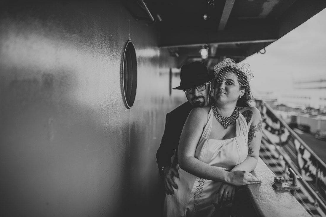 Moody portrait of the bride and groom on the SS Red Oak Victory by Becca Henry Photography