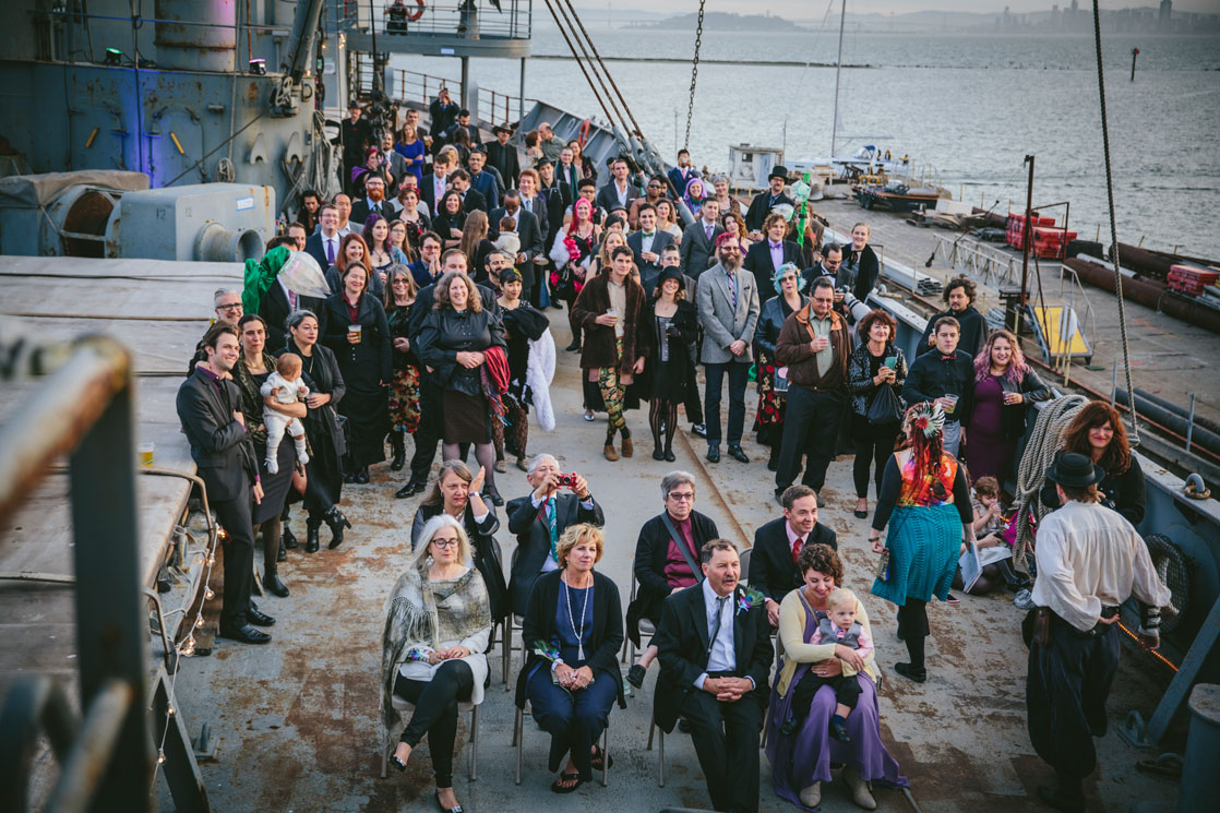 Wedding guests watching the ceremony on the SS Red Oak Victory by Becca Henry Photography.