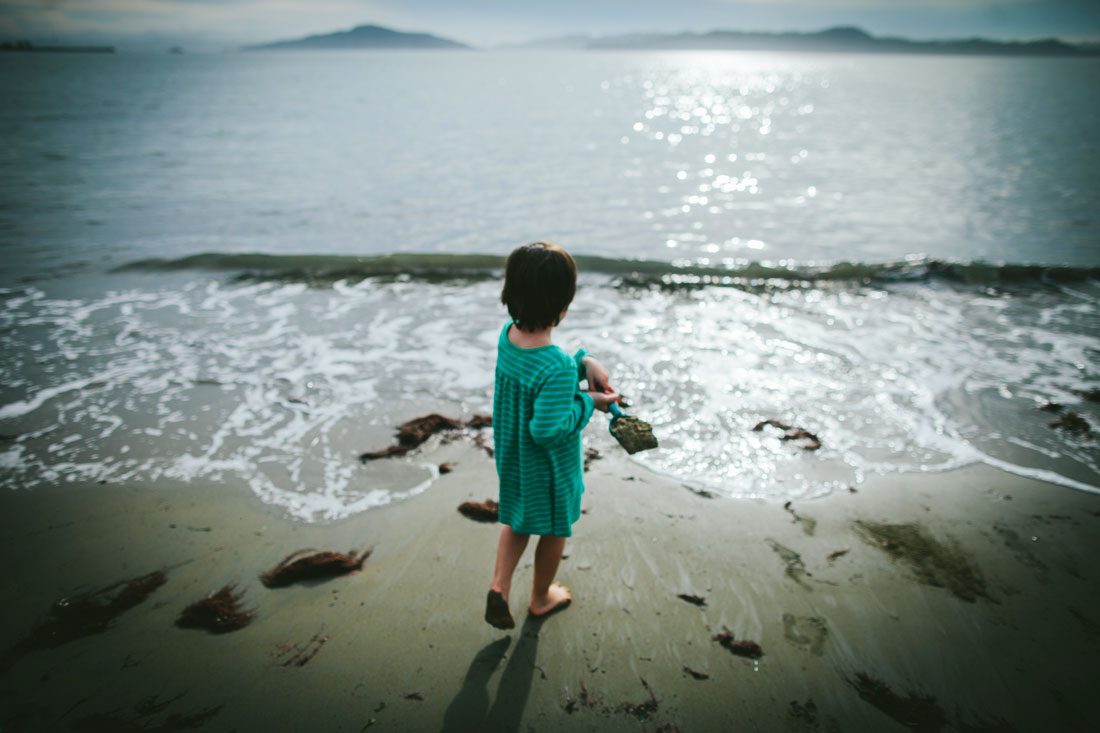 Girl in green dress by the water side by Becca Henry Photography