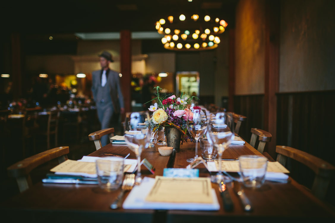 Table arrangement at wedding reception at Oakland venue, El Camino by Becca Henry Photography
