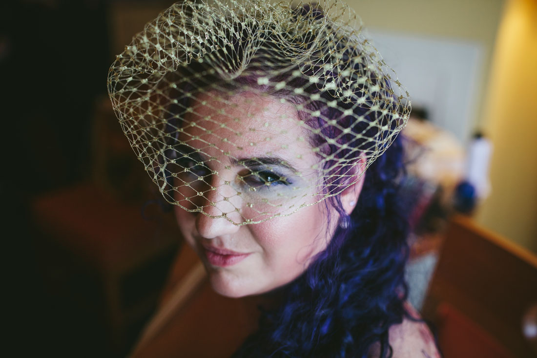 Bride who just had a make-up done with rad purple hair at Waterfront Hotel by Becca Henry Photography.