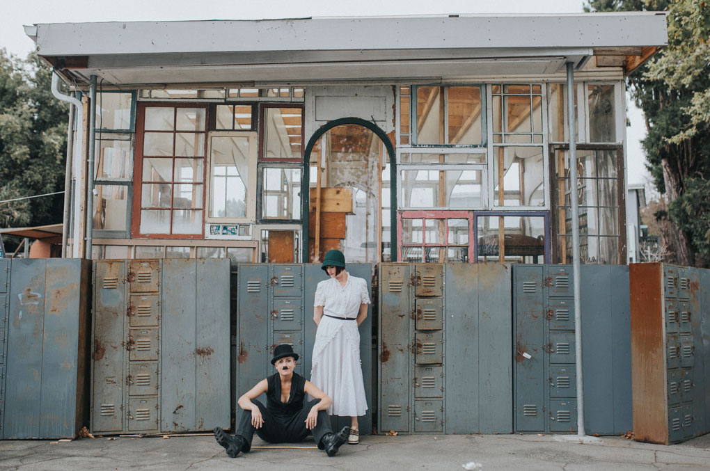 Day after wedding session at Ohmega Salvage in Berkeley- dressed as Charlie Chaplin and ingenue in front of vintage lockers by Becca Henry Photography