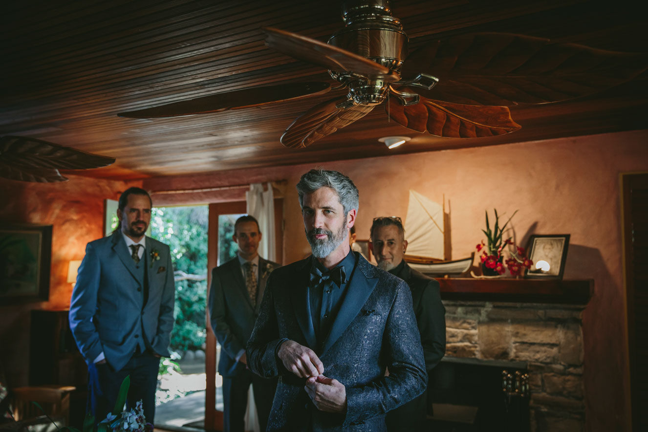Groom and groomsmen strike a pose while getting ready.