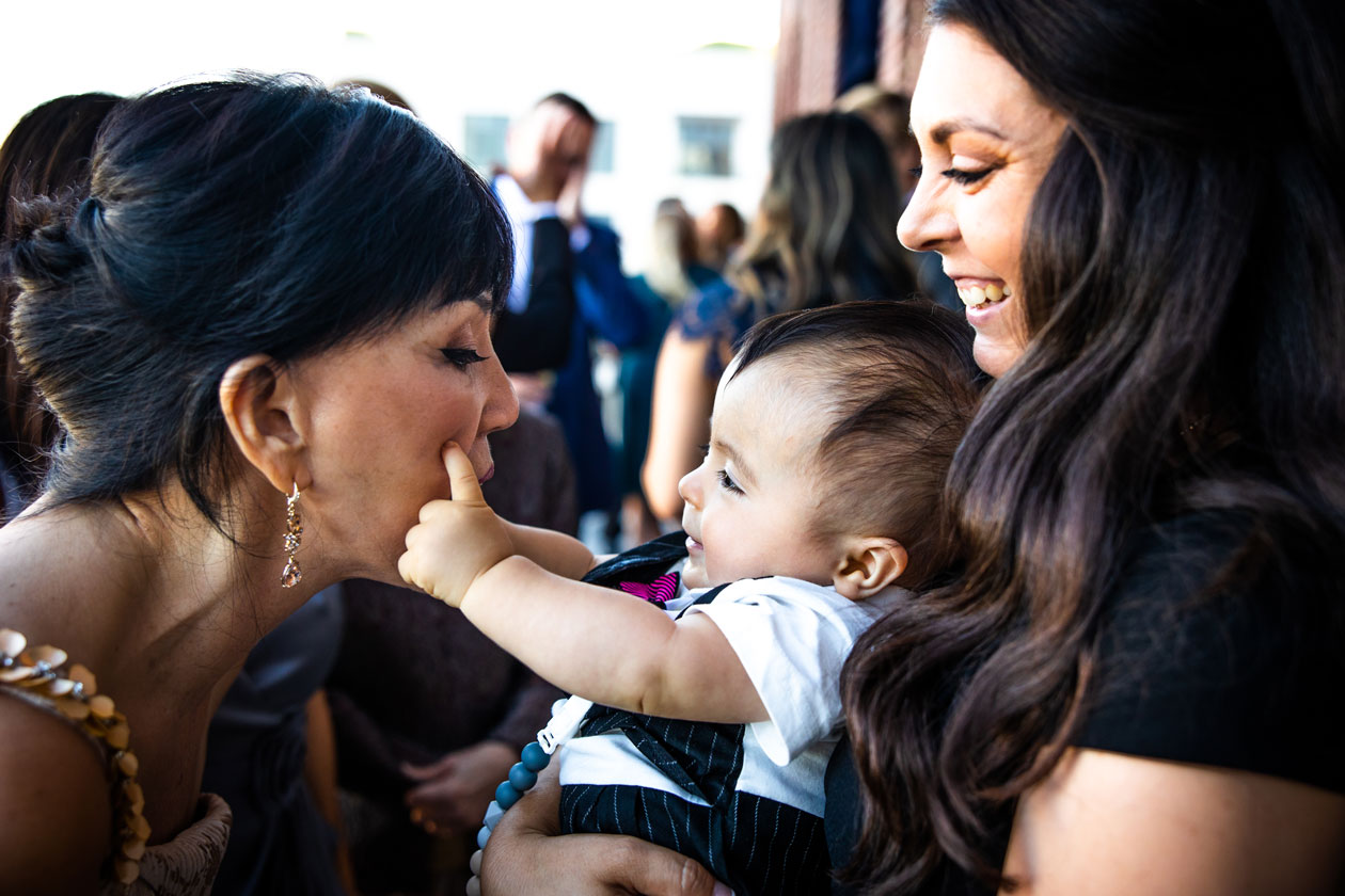 The University Club of San Francisco Wedding - Cute moment with groom's mom and little baby at the reception