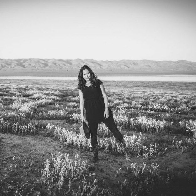 Becca Henry – the photographer standing in a desert field 2 Photographer Becca Henry stands in a desert field
