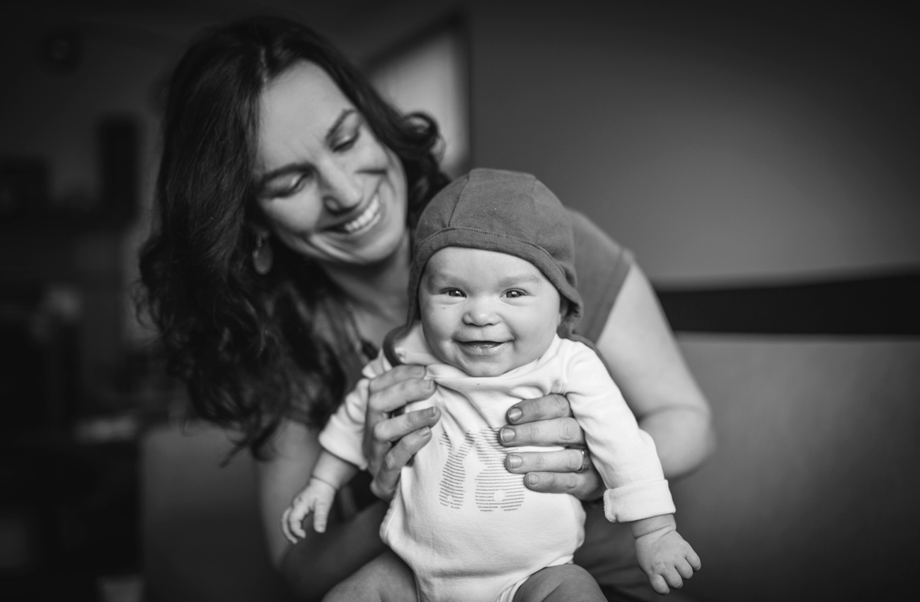 Becca Henry Photography - Oakland Newborn Photography - BW image of mom and giggling baby