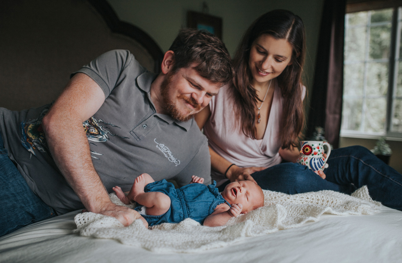 Becca Henry Photography - Newborn Photography in Oakland- parents looking over newborn